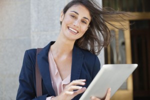 Portrait of smiling businesswoman using digital tablet